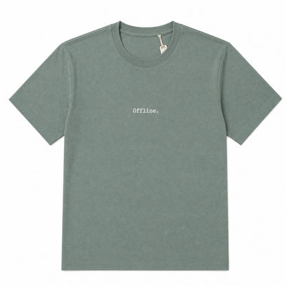 A muted sage green crewneck t-shirt with the word 'Offline.' printed in a small, typewriter-style font on the center chest.