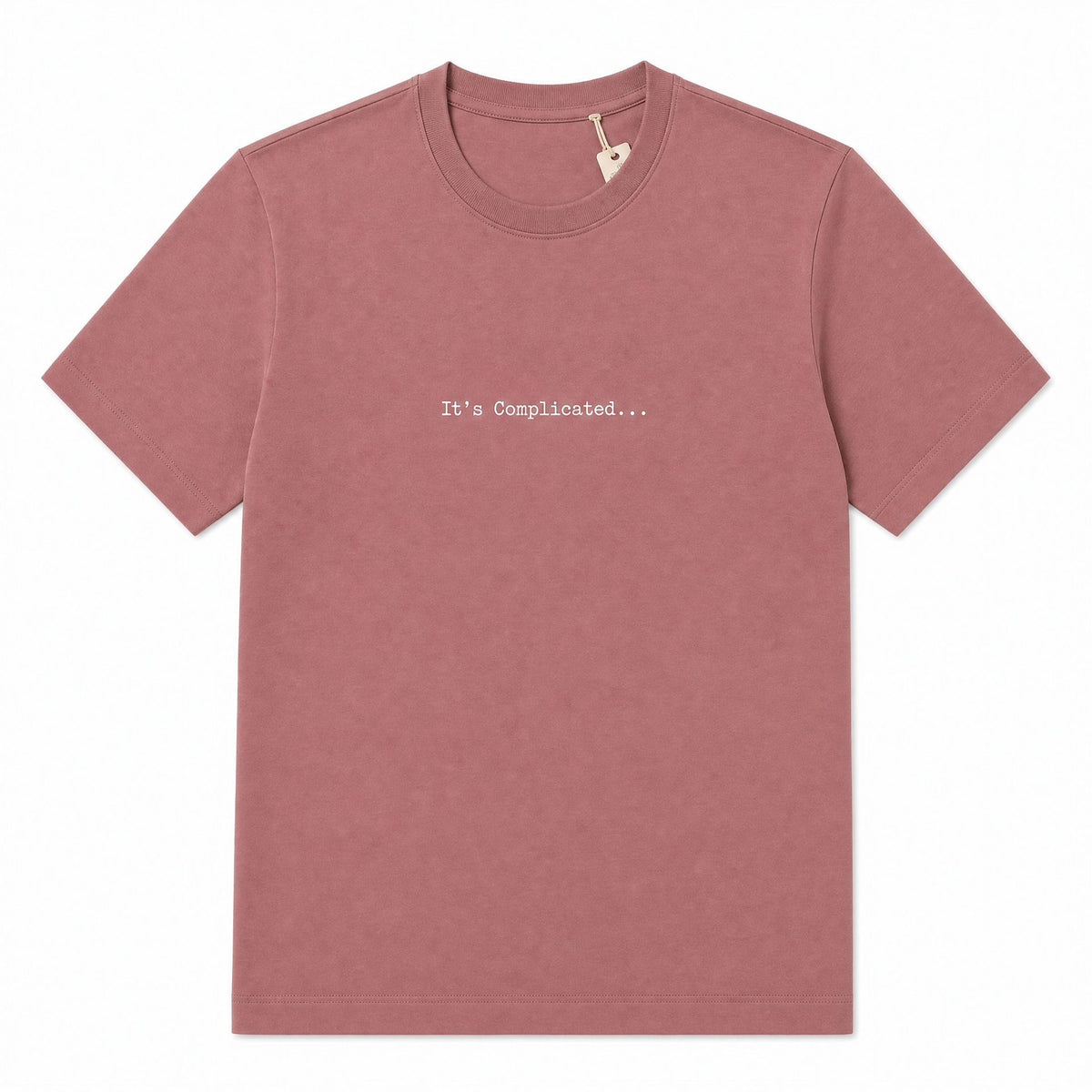 A dusty rose short-sleeve crewneck t-shirt with the text 'It's Complicated.