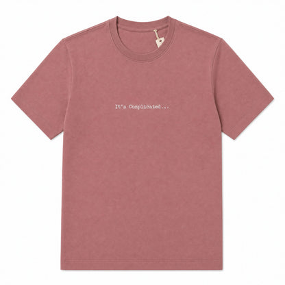 A dusty rose short-sleeve crewneck t-shirt with the text 'It's Complicated.