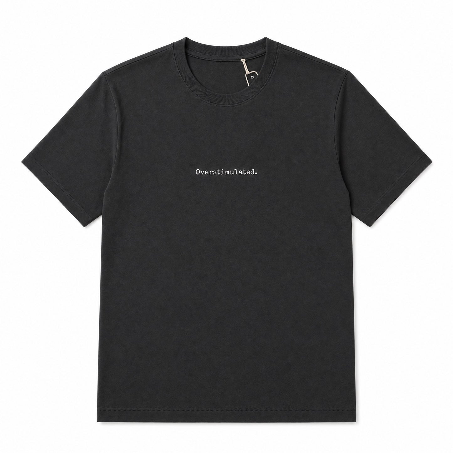 A black short-sleeve crewneck t-shirt with the word 'Overstimulated.' printed in small white serif text on the center chest, displayed flat against a solid white background.
