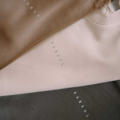 Close-up of fabric with 'Gambol' branding in different colors.