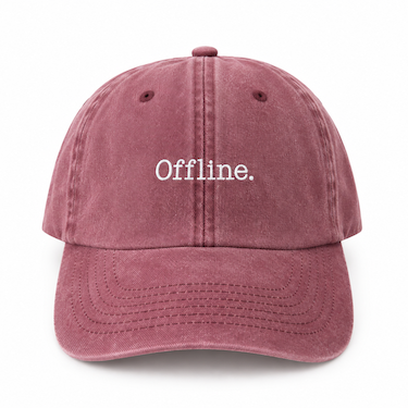 A dusty rose pink washed cotton baseball cap with the word 'Offline.' embroidered in white on the front, shown against a plain white background.