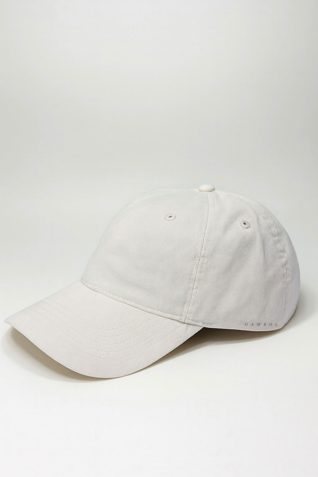 Light cream baseball cap on a white background