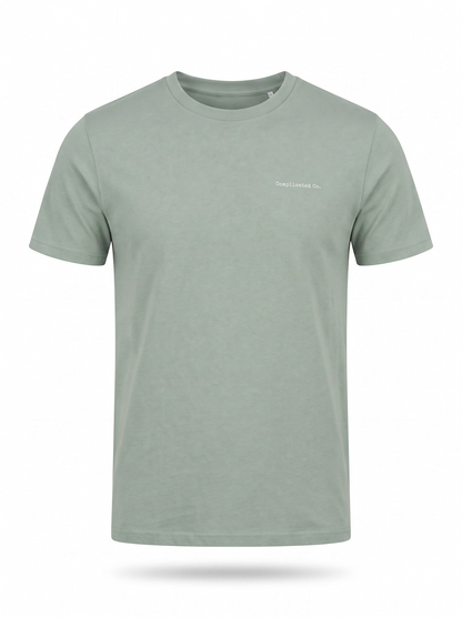 A light sage green crewneck t-shirt with a small white printed logo on the left chest, displayed on a clean white background with a soft drop shadow.