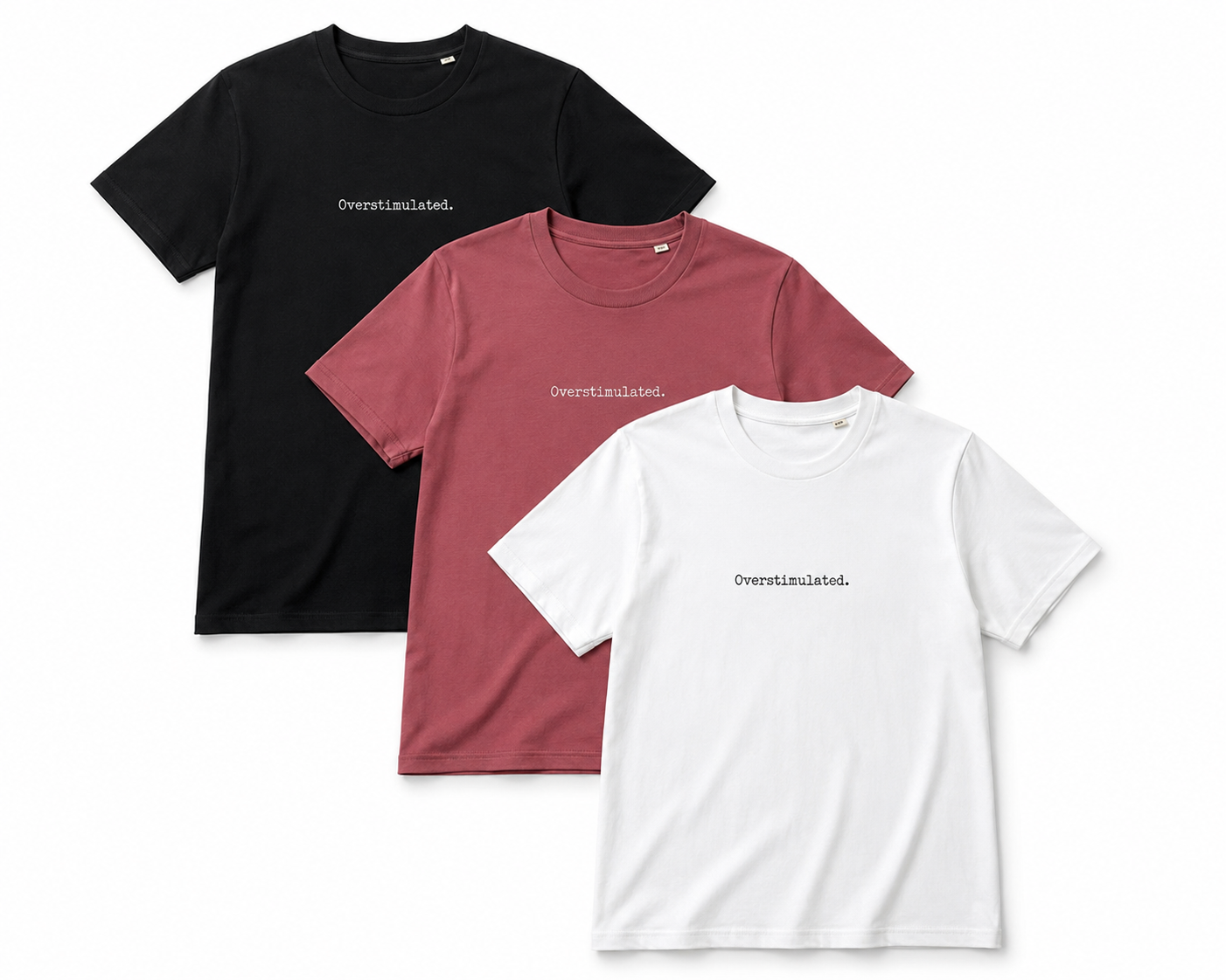Three short-sleeve crewneck t-shirts in black, dusty rose, and white, arranged in a layered flat-lay. Each shirt features the word 'Overestimated.