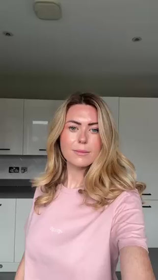 blonde girl wearing a pink spicy slogan t-shirt