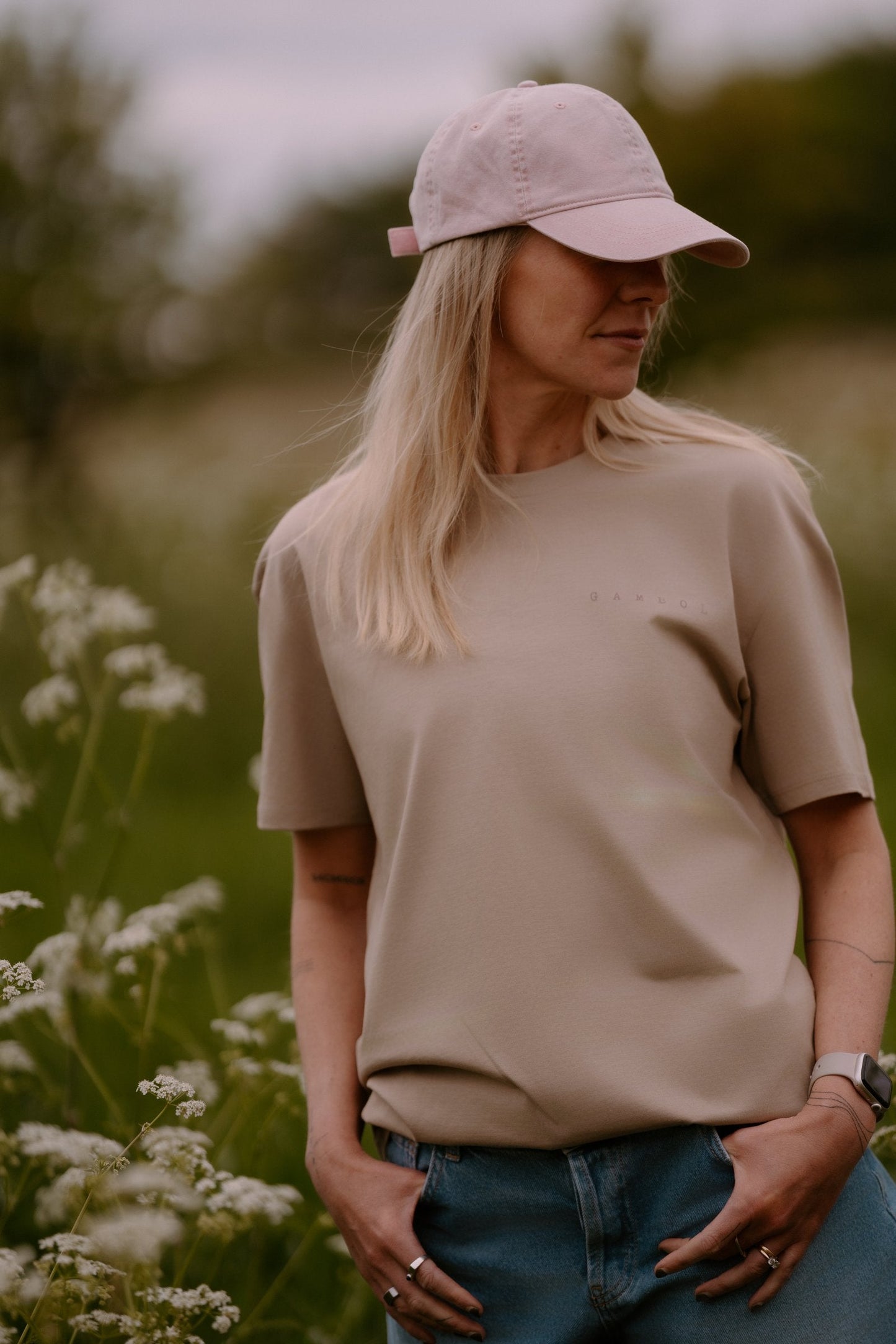 The Relaxed Cap in Petal, worn