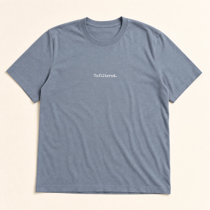 Blue t-shirt with 'Unfiltered.' text on a beige background